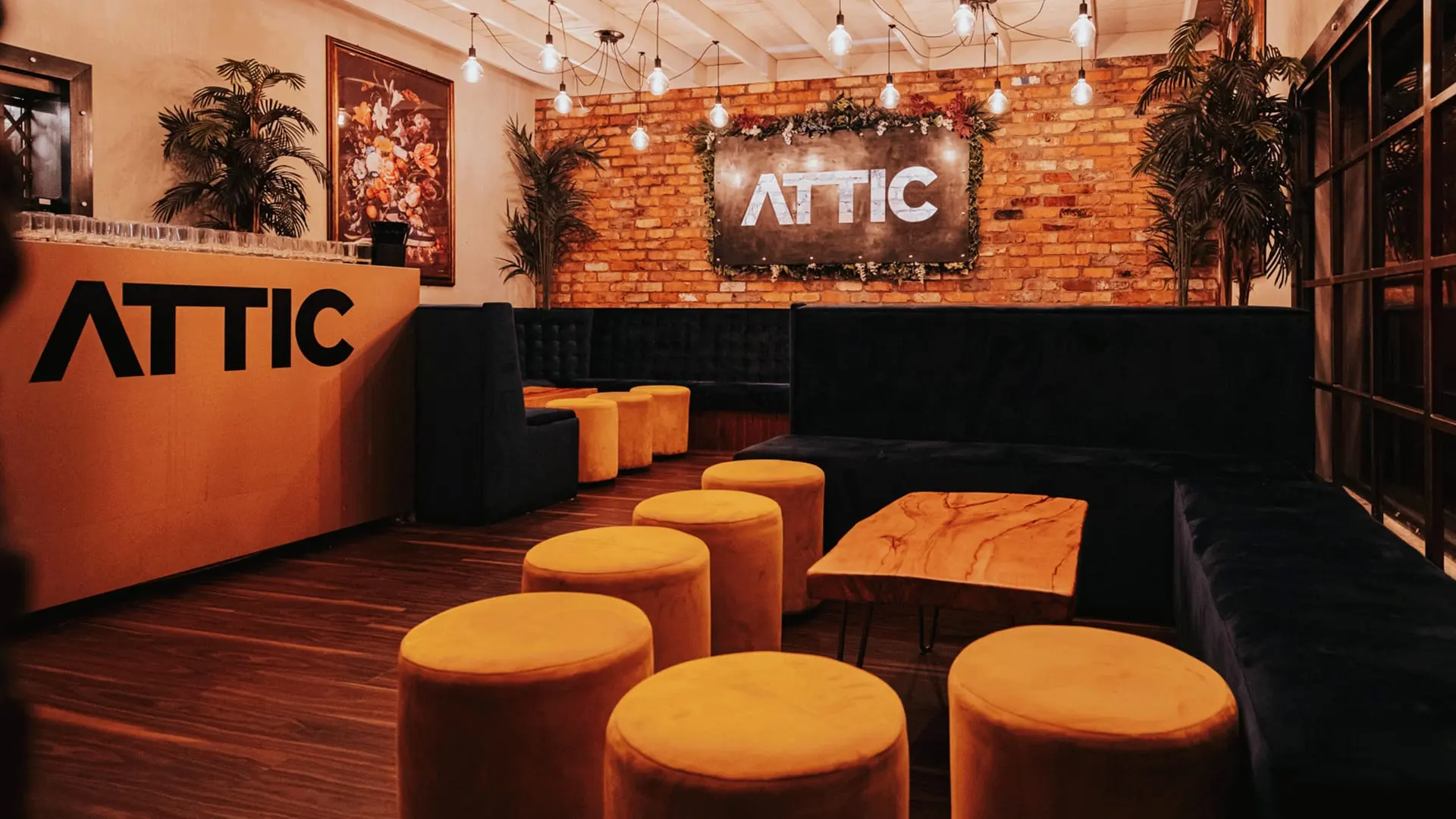 The Attic VIP room at Thompsons with warm lighting and booth seating