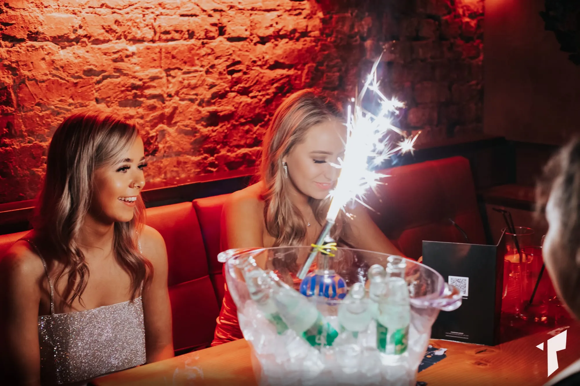 Reserved tables at Thompsons, lit red before doors